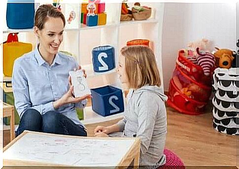 Child psychologist with a child at the table