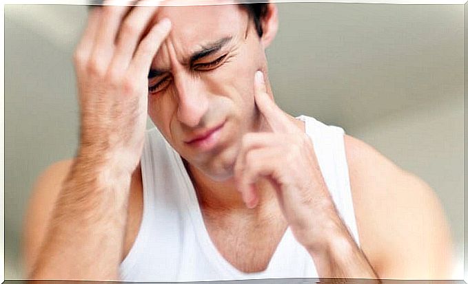 Man who suffers from bruxism and therefore feels pain in his jaw