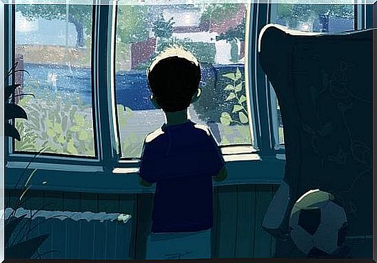 Boy standing in front of a window