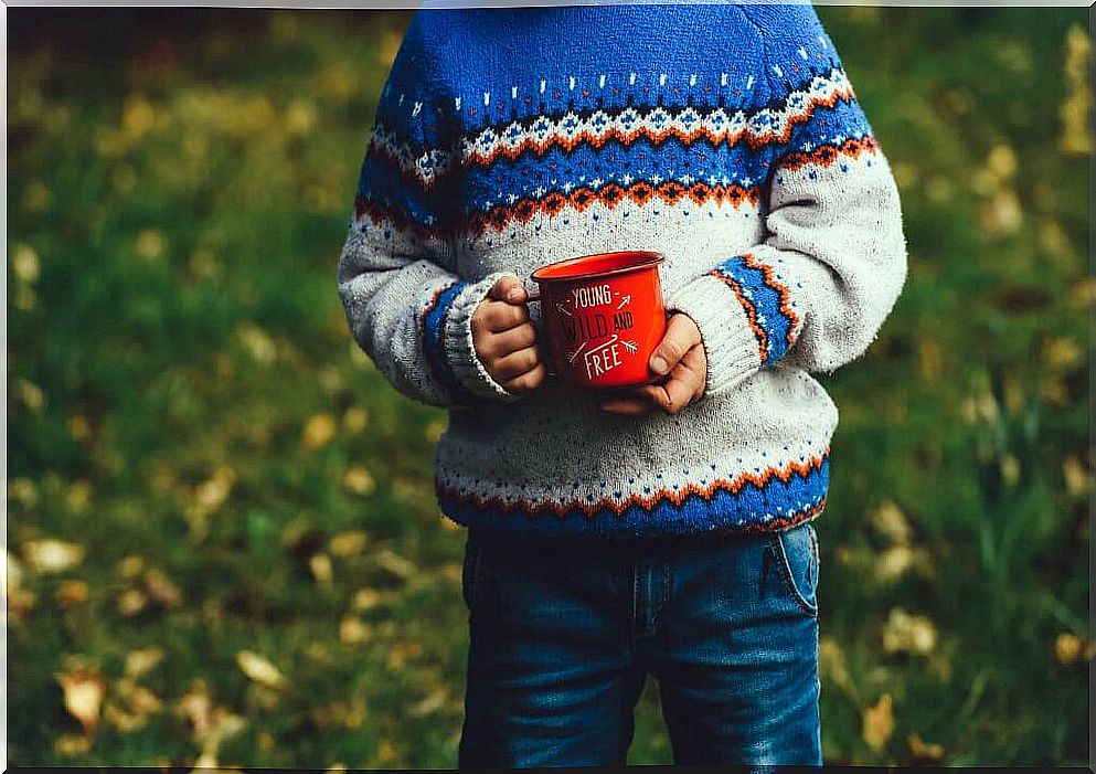 Child drinking with mug