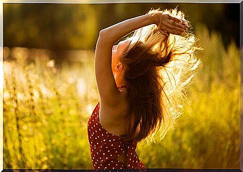 Happy woman in a sunny field