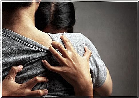 Girl hugging her boyfriend very tightly because she is prone to emotional dependence